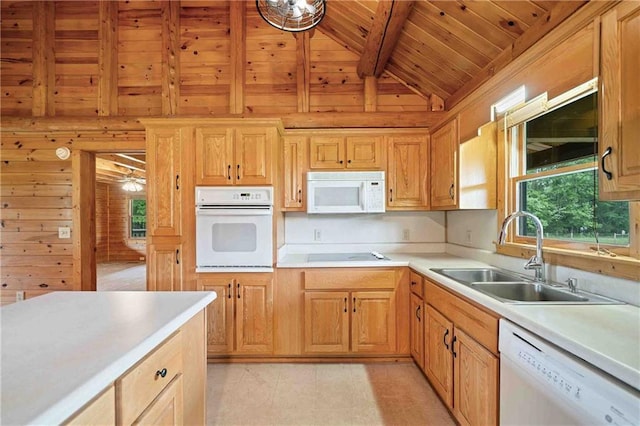 kitchen featuring a sink, white appliances, light countertops, beamed ceiling, and wood ceiling