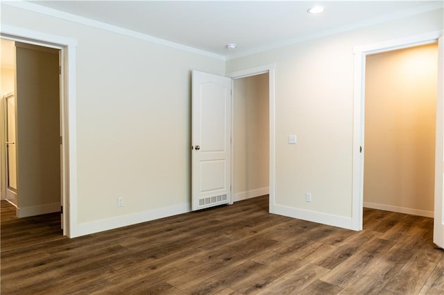 unfurnished bedroom featuring crown molding, recessed lighting, baseboards, and dark wood-style floors