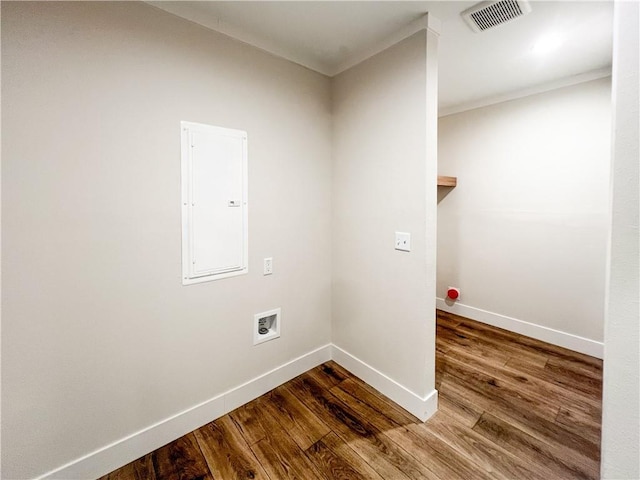 laundry room with laundry area, washer hookup, wood finished floors, visible vents, and electric panel