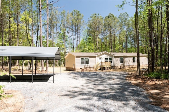 manufactured / mobile home with crawl space and a detached carport