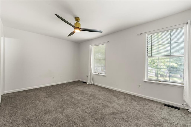 732 Jamestown Xing, Jonesboro, GA 30238 - empty room with plenty of natural light, a ceiling fan, and carpet