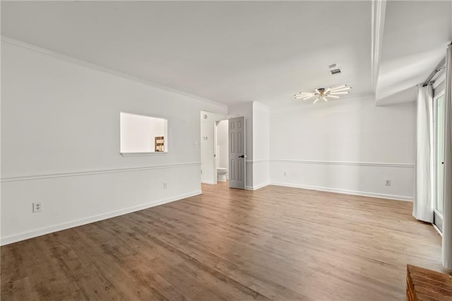 732 Jamestown Xing, Jonesboro, GA 30238 - empty room featuring wood finished floors, ornamental molding, and ceiling fan