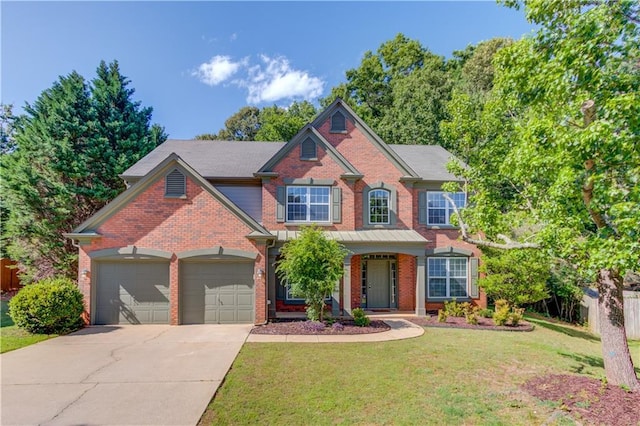 5115 Amberden Hall Dr, Suwanee, GA 30024 - view of front of home featuring brick siding, a garage, driveway, and a front yard