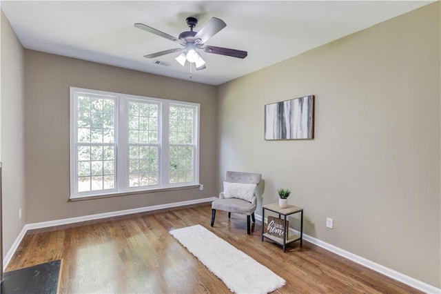 5115 Amberden Hall Dr, Suwanee, GA 30024 - living area with healthy amount of natural light, baseboards, and wood finished floors