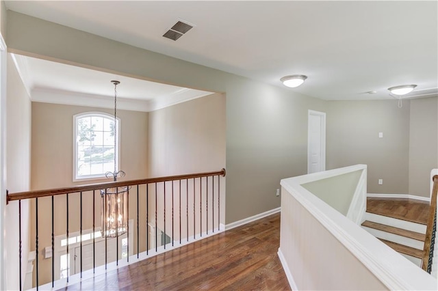5115 Amberden Hall Dr, Suwanee, GA 30024 - hall with dark wood-style flooring, baseboards, a chandelier, and an upstairs landing