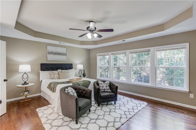 5115 Amberden Hall Dr, Suwanee, GA 30024 - bedroom with a tray ceiling, baseboards, wood finished floors, and ceiling fan