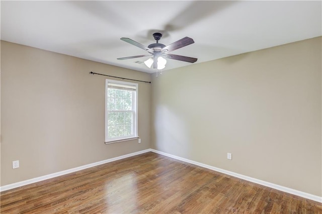 5115 Amberden Hall Dr, Suwanee, GA 30024 - empty room with baseboards, a ceiling fan, and wood finished floors