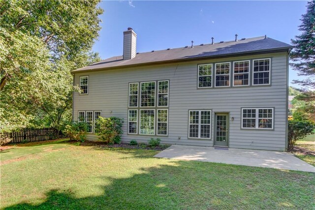 5115 Amberden Hall Dr, Suwanee, GA 30024 - back of property featuring a chimney and a patio