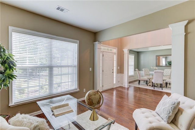 5115 Amberden Hall Dr, Suwanee, GA 30024 - living room featuring decorative columns and wood finished floors