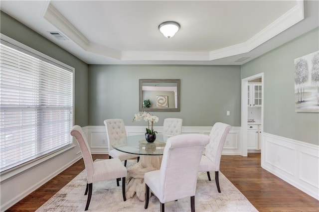 5115 Amberden Hall Dr, Suwanee, GA 30024 - dining room with a raised ceiling, wood finished floors, a wainscoted wall, ornamental molding, and a decorative wall