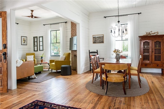 dining space with a chandelier and wood-type flooring