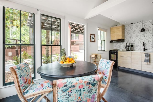 dining space featuring concrete flooring