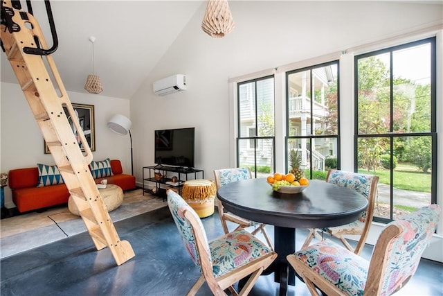 dining area with a wall unit AC and high vaulted ceiling