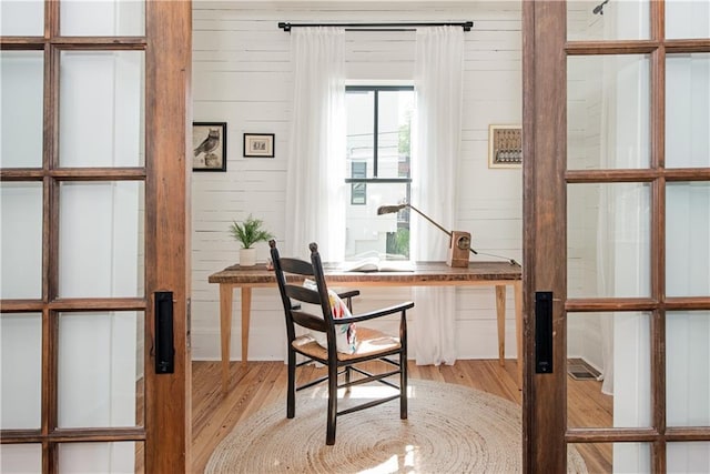 office with wood finished floors and wooden walls