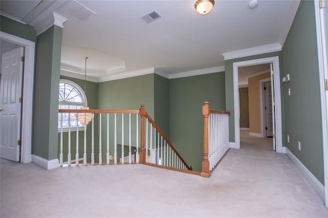 hall featuring baseboards, visible vents, light colored carpet, and an upstairs landing