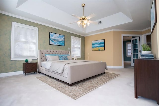 bedroom with baseboards, a raised ceiling, and wallpapered walls