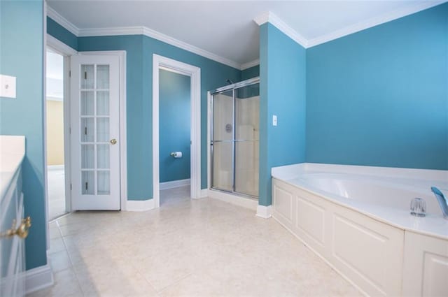 bathroom with a garden tub, a shower stall, ornamental molding, and baseboards