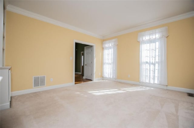 unfurnished living room with crown molding, visible vents, and light colored carpet