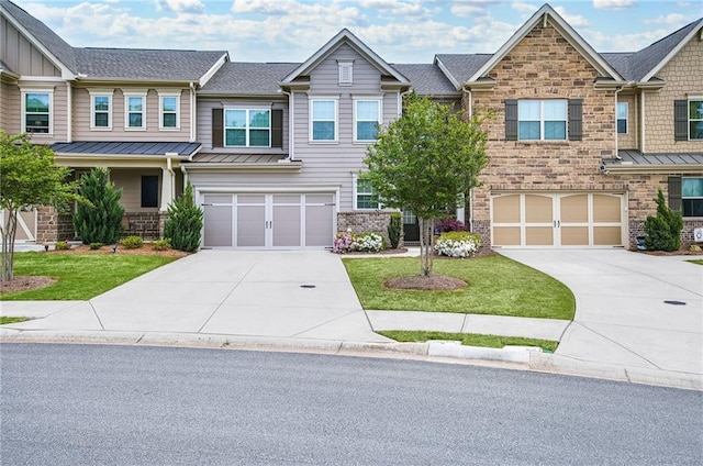 view of front of house featuring a garage and a front yard