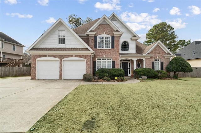 view of front of house with a garage and a front lawn