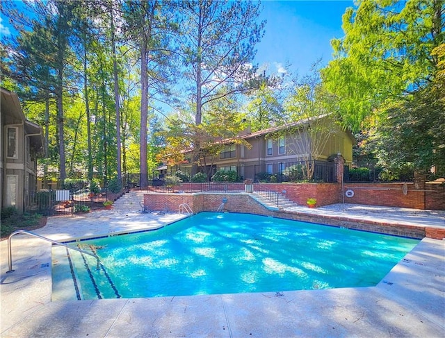 view of pool with fence