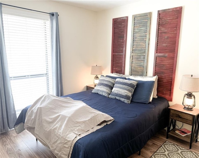 bedroom with wood finished floors