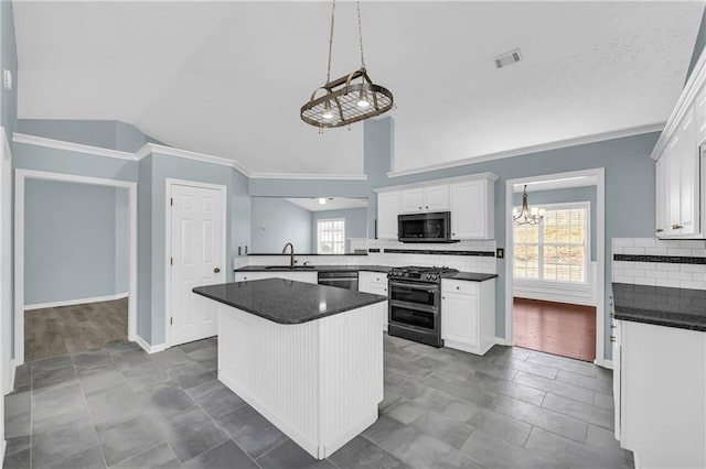 kitchen with white cabinetry, sink, tasteful backsplash, and appliances with stainless steel finishes