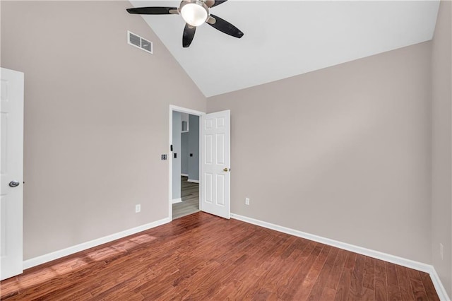 unfurnished room featuring hardwood / wood-style flooring, ceiling fan, and high vaulted ceiling