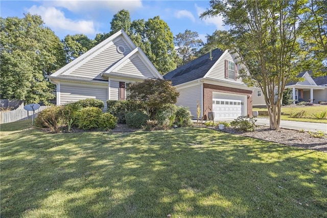 view of front of house with a garage and a front yard