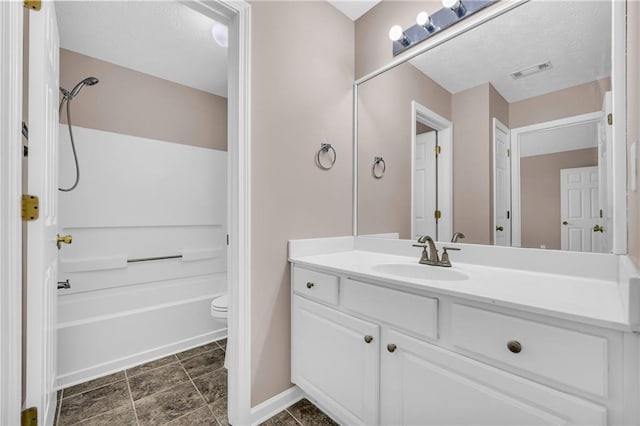 full bathroom featuring vanity, shower / bathing tub combination, and toilet