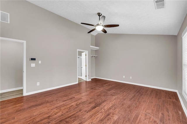 unfurnished living room with hardwood / wood-style floors, a textured ceiling, and ceiling fan