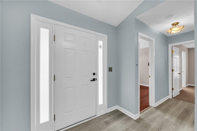 foyer entrance featuring light hardwood / wood-style flooring