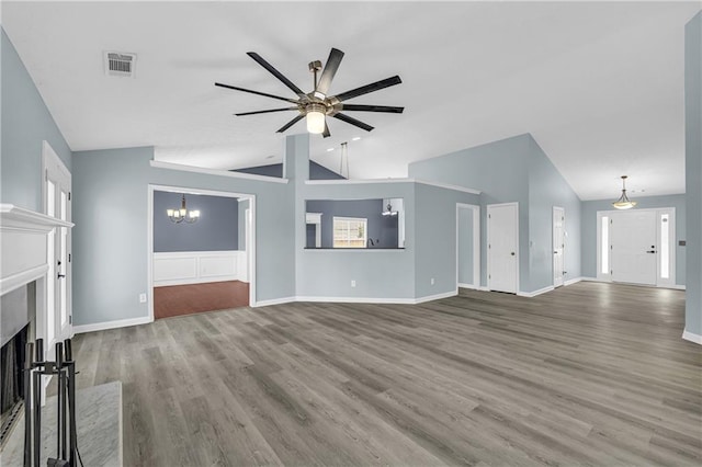 unfurnished living room featuring lofted ceiling, hardwood / wood-style floors, a high end fireplace, and ceiling fan