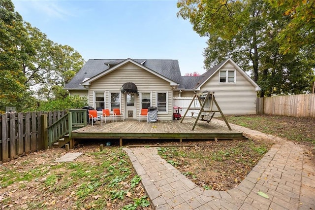 back of house featuring a deck