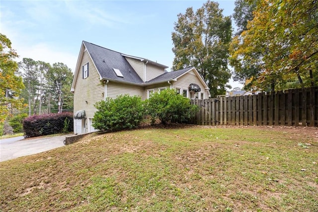 view of home's exterior featuring a yard