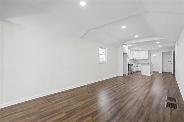 unfurnished living room featuring dark hardwood / wood-style flooring and vaulted ceiling