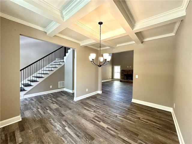 unfurnished dining area with visible vents, stairway, dark wood finished floors, and baseboards