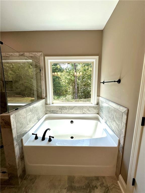 bathroom with a garden tub