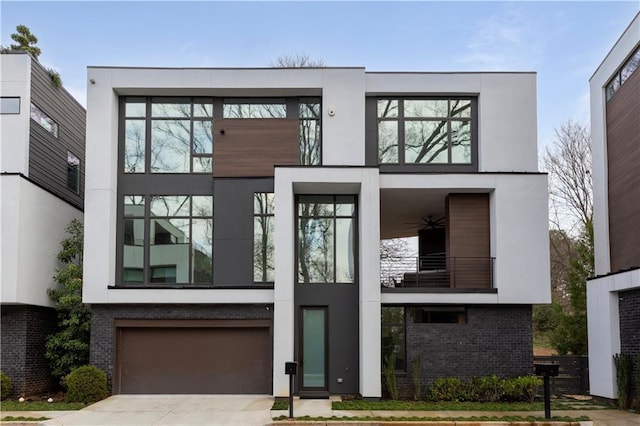 contemporary house with a balcony and a garage