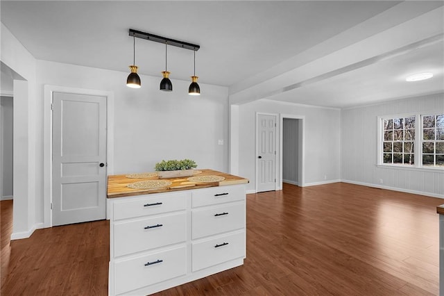 kitchen featuring pendant lighting, dark hardwood / wood-style floors, and white cabinets