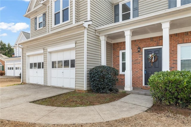 property entrance with a garage and a porch