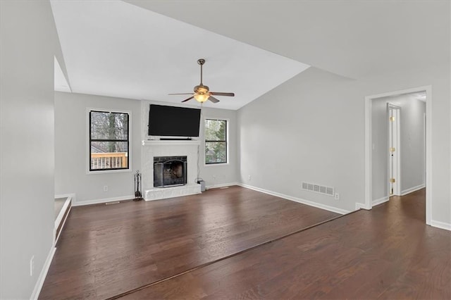 unfurnished living room featuring dark wood-type flooring, ceiling fan, and vaulted ceiling