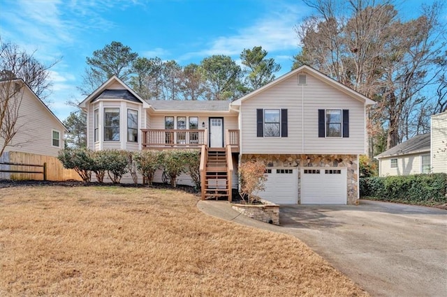 view of front facade featuring a garage and a front lawn