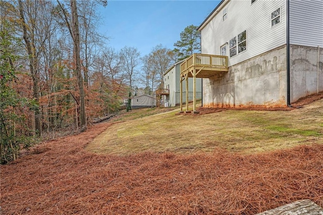 view of yard featuring a wooden deck