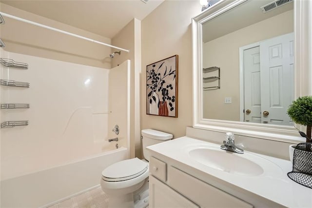 full bathroom featuring toilet, vanity, and tub / shower combination