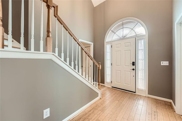 foyer entrance with light wood-type flooring