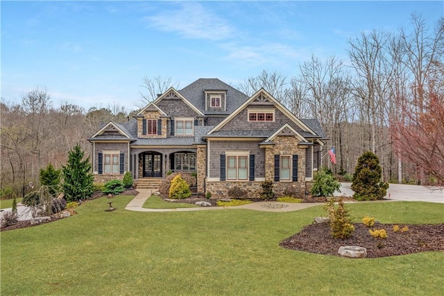 craftsman-style home featuring a front lawn