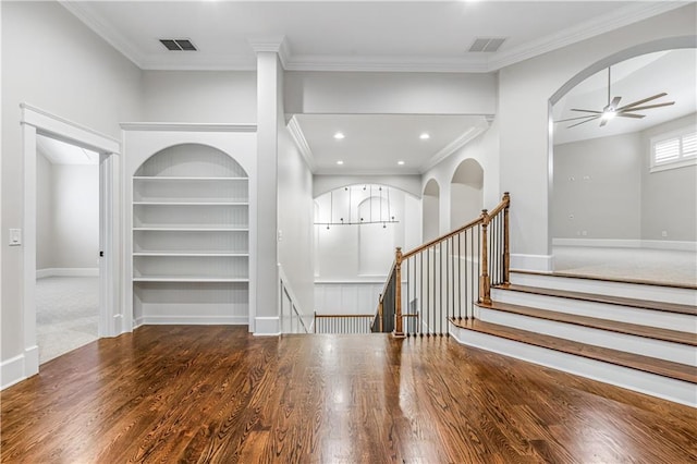 entryway featuring visible vents, baseboards, wood finished floors, and a ceiling fan