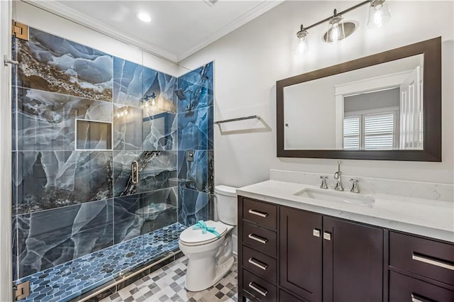 full bath with vanity, toilet, tiled shower, and ornamental molding