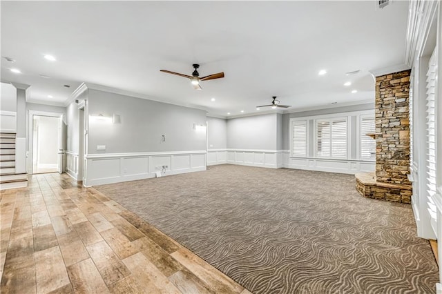 unfurnished living room featuring stairs, recessed lighting, light wood-style floors, and a ceiling fan